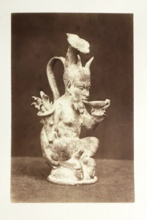 Photographie-anonyme-circa-1860-1880-dun-faune-en-bronze-ancien-barbu-fourchu-cornu-et-en-erection-buvant-a-une-coupe